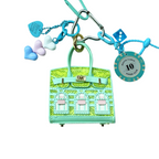 Lime Green snakeskin leather mini bag charm with keychain shaped like a house, featuring window panels and a top handle.