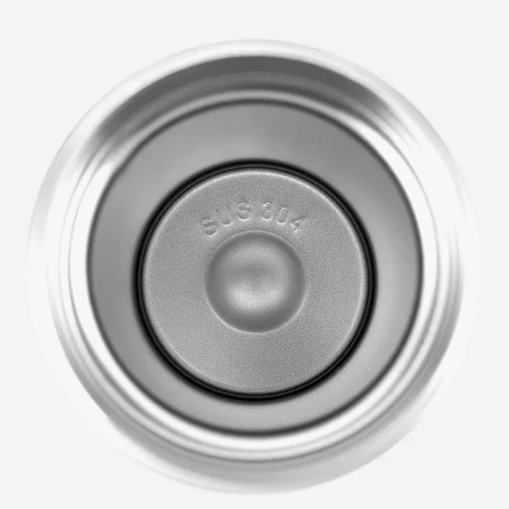 Stainless steel coffee filter with 304 stainless steel inner core on a green background