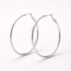 Pair of silver hoop earrings on a white background