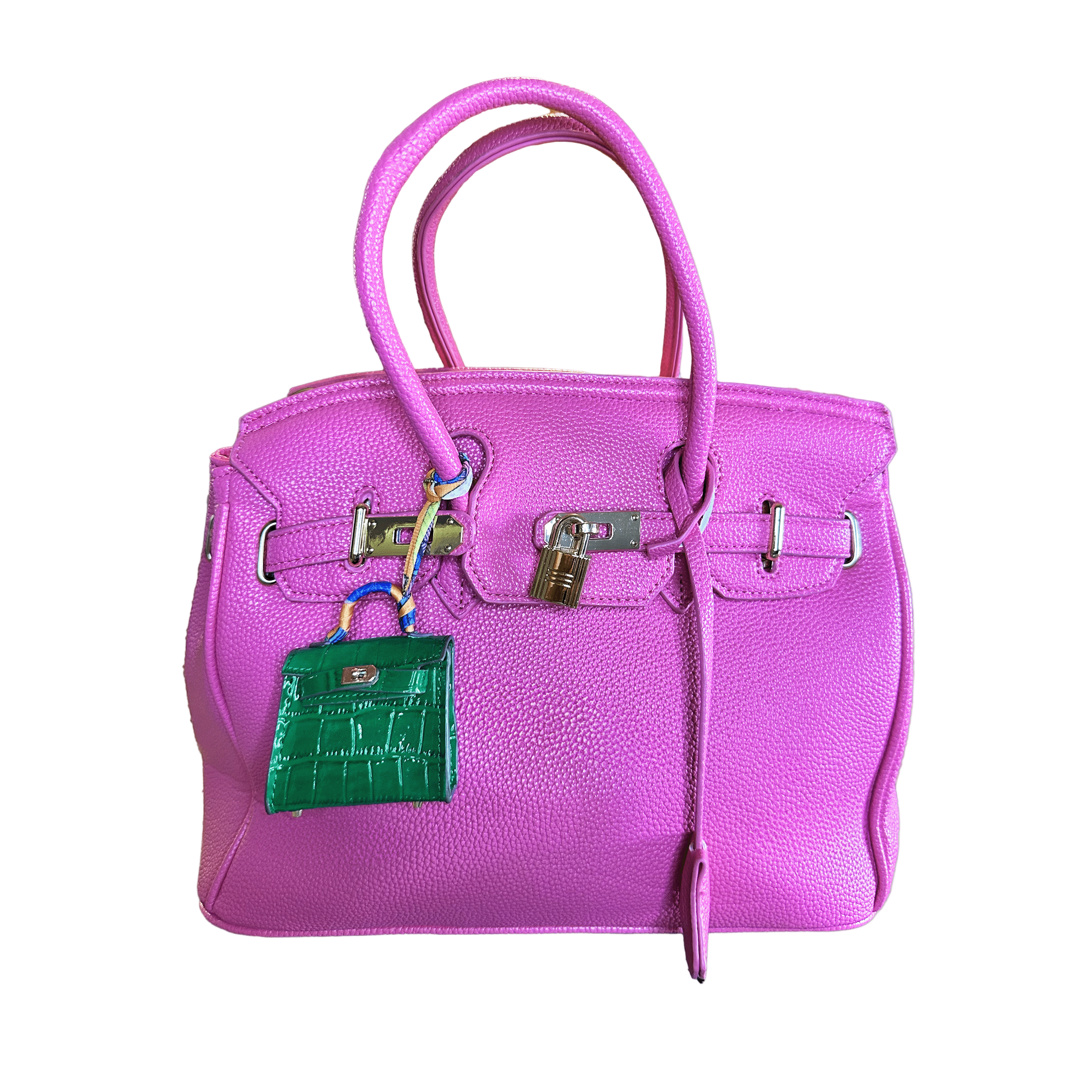 Purple handbag with a green mini bag charm keychain on a white background