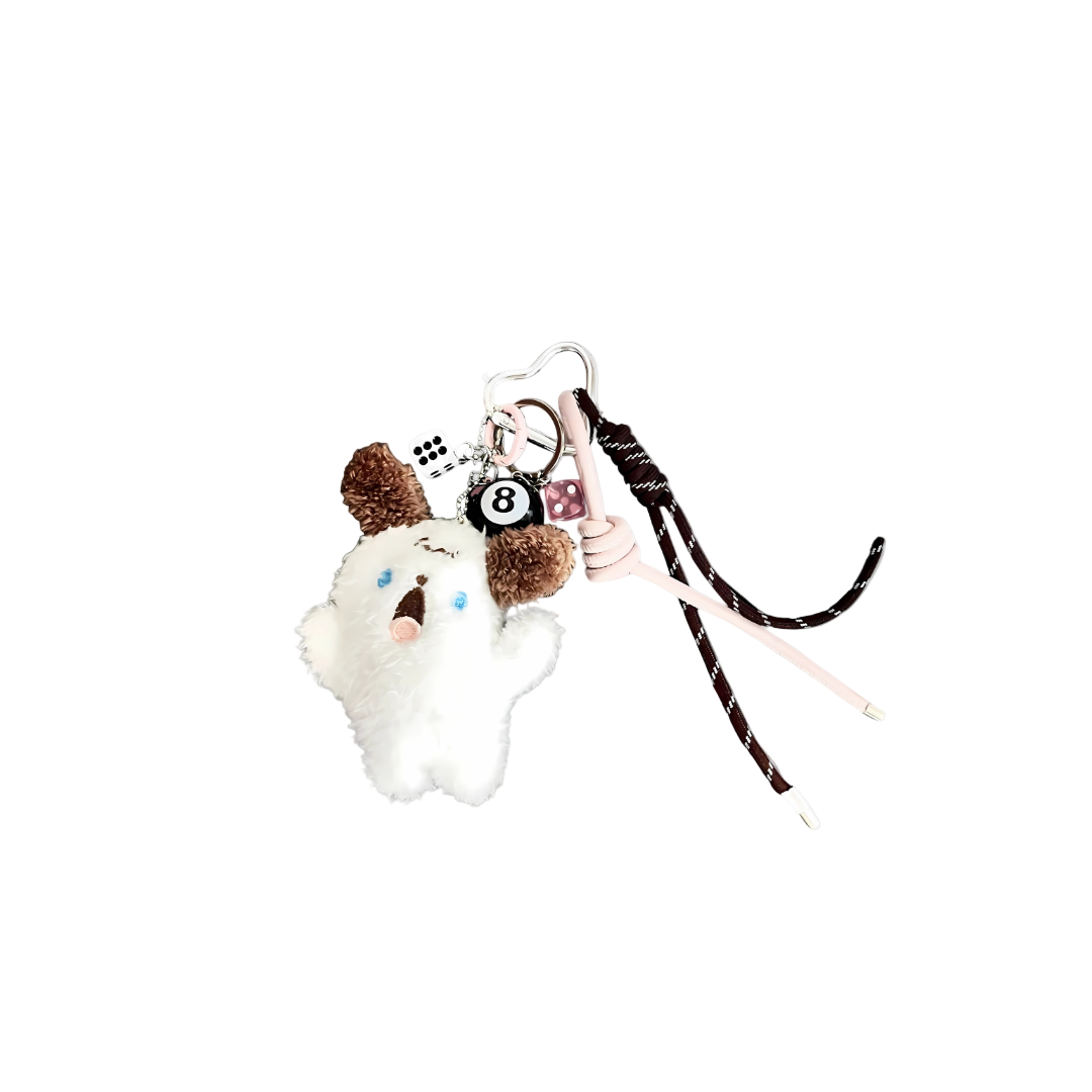 White and brown plush bunny charm with wide eyes (surprised expression), 8-ball charm, and pink dice components hanging from a keychain.