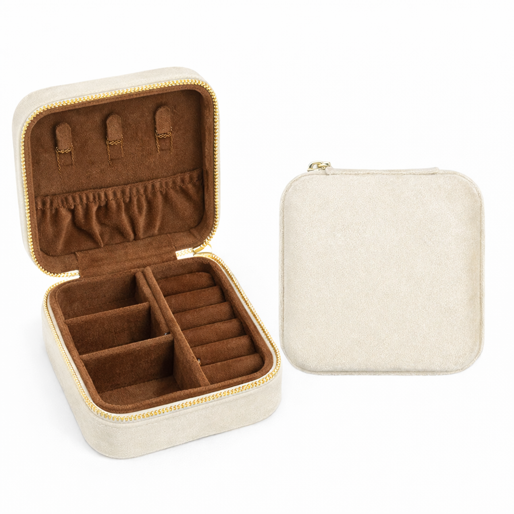 Jewelry case with brown interior and beige exterior, open to show compartments.