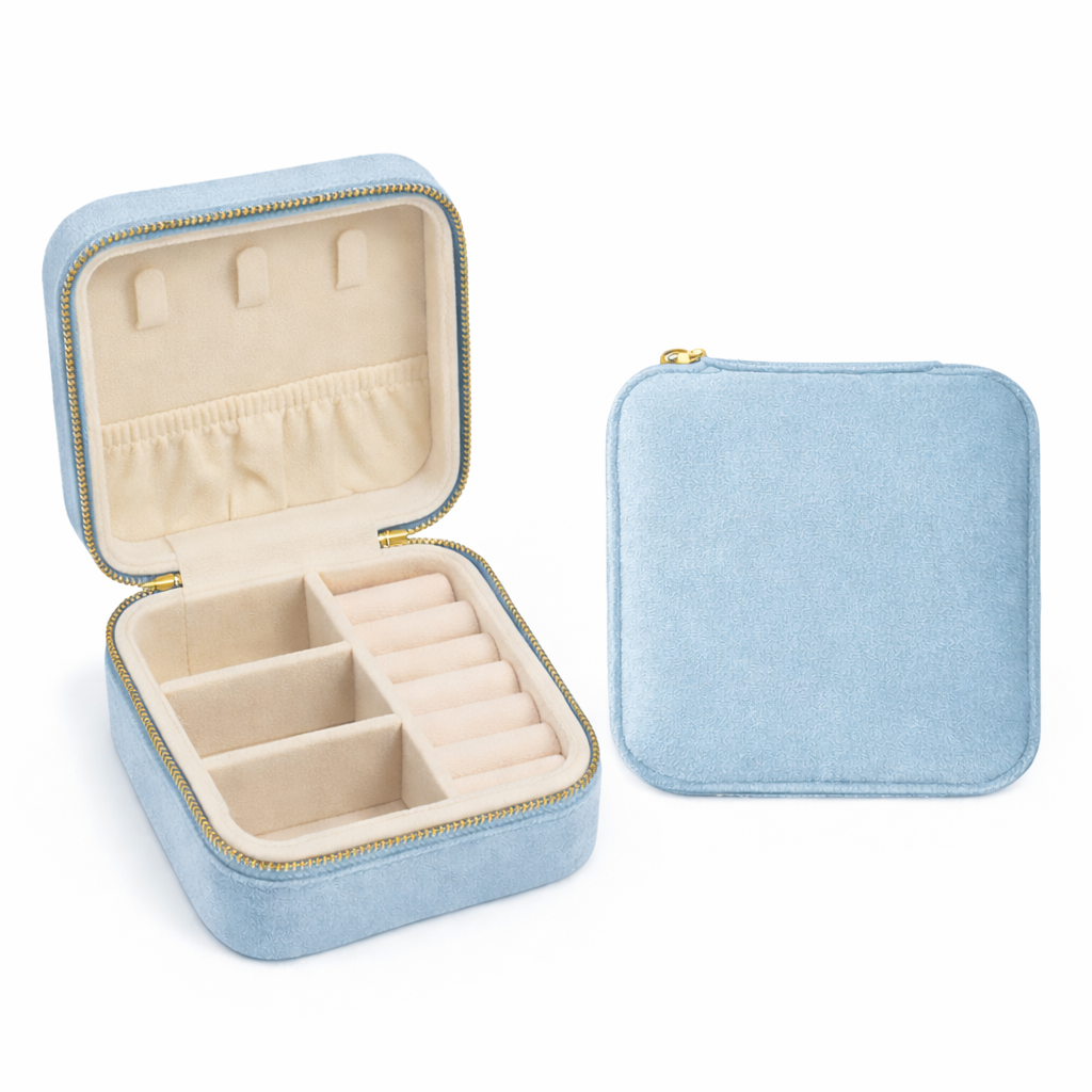 Light blue jewelry box with open lid showing compartments on a white background