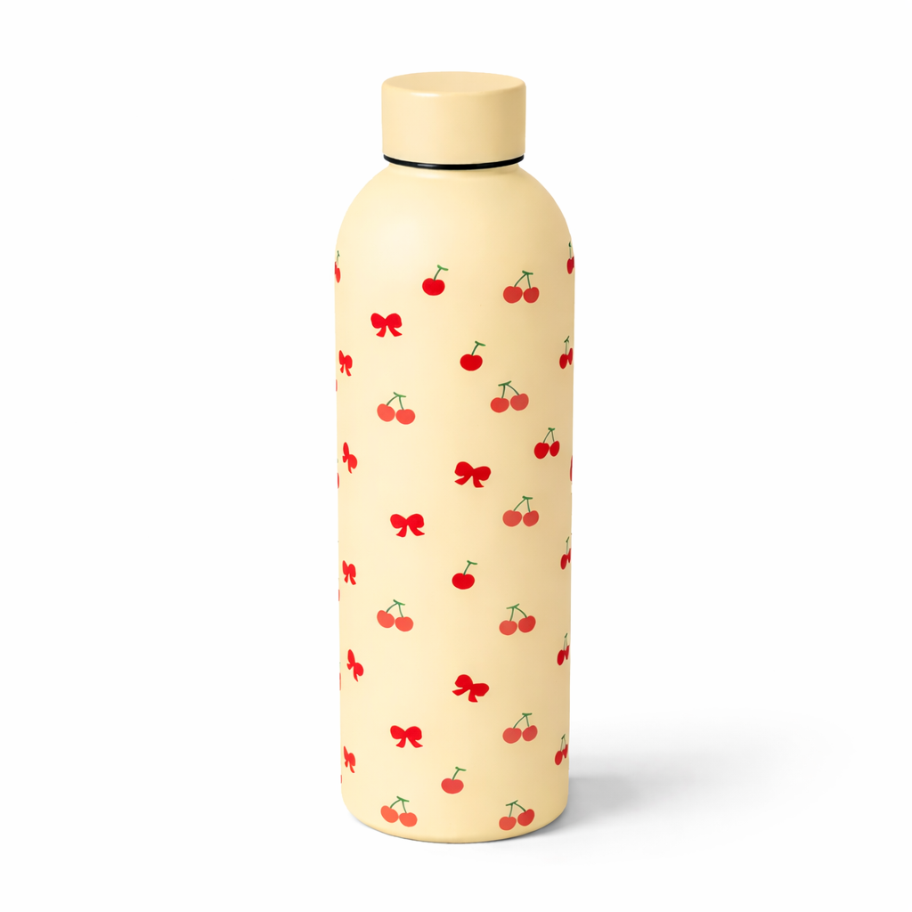 Beige water bottle with red cherry and bow pattern on a white background