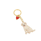 Dog-shaped white labrador keychain with a red heart on a white background