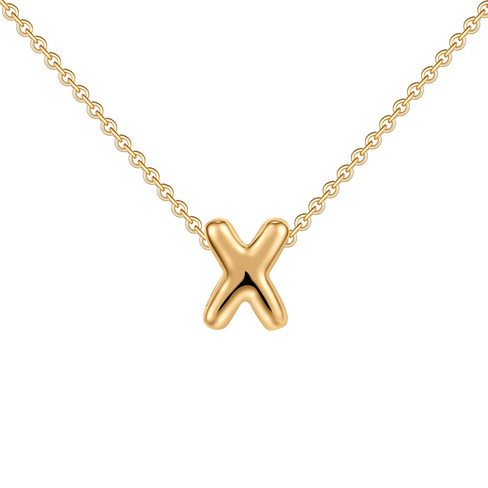 Gold necklace with a 'X' pendant on a white background