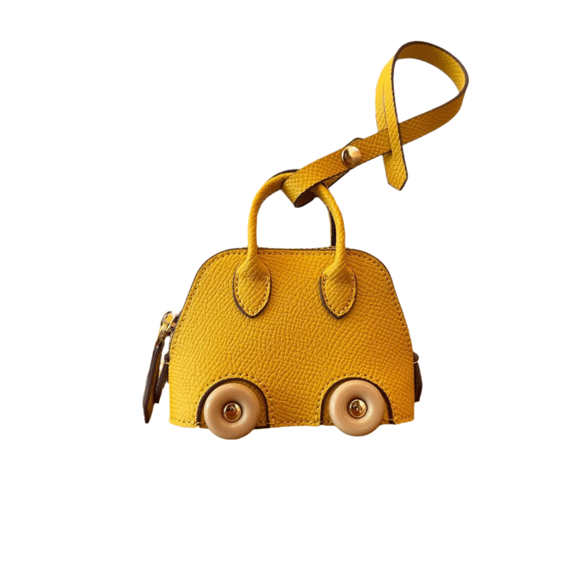 Yellow car-shaped mini bag charm for handbag with wheels on a white background